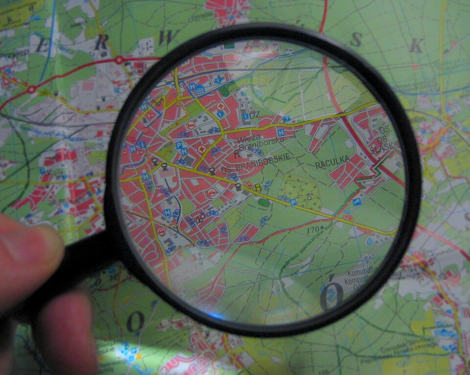 The magnifying glass illustrates checking. In science, looking more carefully also means changing a question or test rather than simply reading the same example for longer.